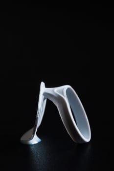 flat-angled close-up of a Tetrapack closure on black background