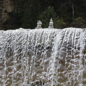"Steinmanderl"" was built above a waterfall. Steinmanderl are the Bavarian term for stones stacked on top of each other on a stream."
