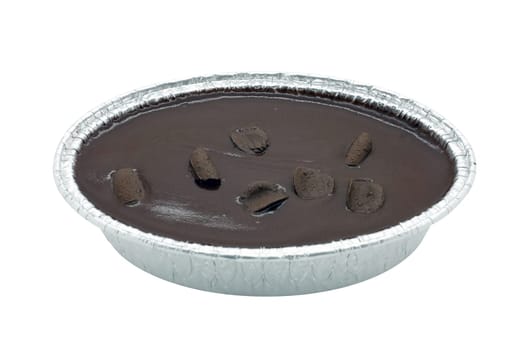 Chocolate cake in foil oval box isolated on white background