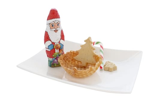 Ice cream in wafer cone / bowl with christmas decoration isolated on white background