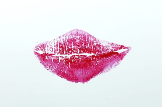 Red lipstick on white background