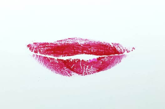 Red lipstick on white background