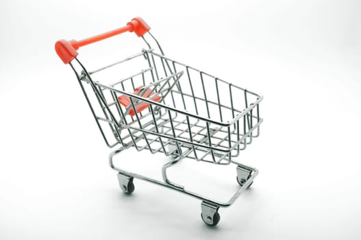 Empty shopping cart, side view, on white background