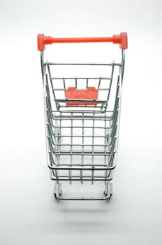 Empty shopping cart, side view, on white background