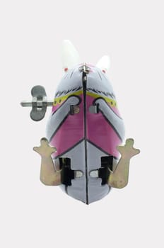 Wind-up vintage toy rabbit isolated on white background