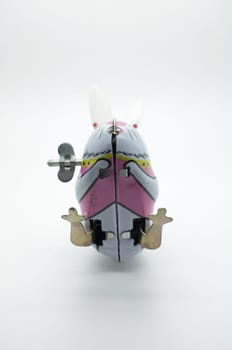 Wind-up vintage toy rabbit isolated on white background