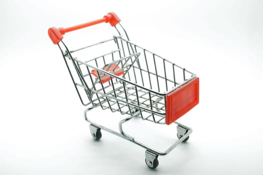 Empty shopping cart, side view, on white background