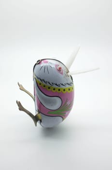 Wind-up vintage toy rabbit isolated on white background