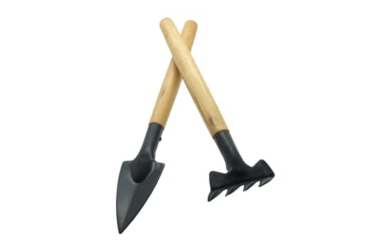 Shovel and rake isolated on white background, collection of gardening tools
