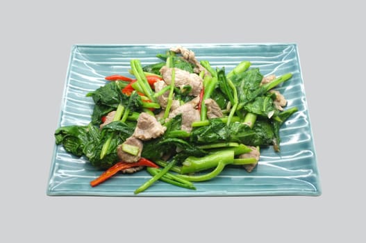 Stir fry chinese kale, cabbage with pork and red chili