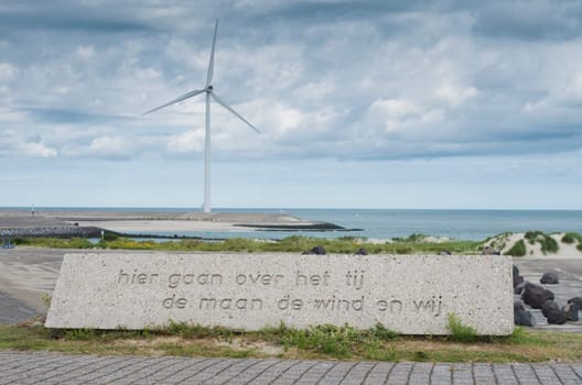 Dutch phrase on a stone on the artificial island Neeltje Jans in Zeeland, Netherlands. It says