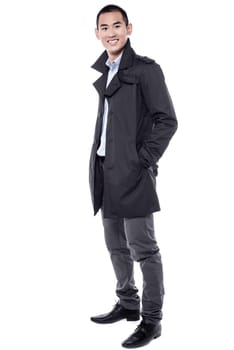 Young man posing sideways over white background