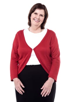 Woman posing casually to camera against white