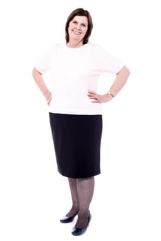Full length woman posing with hands on hips