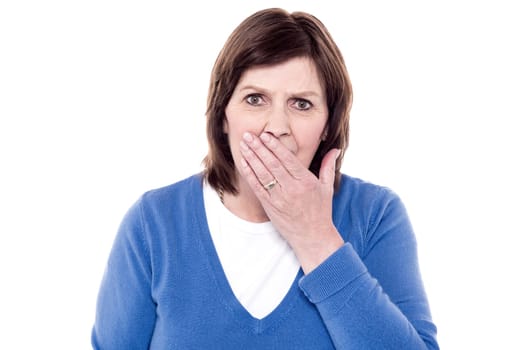 Woman yawning of tiredness and posing to camera