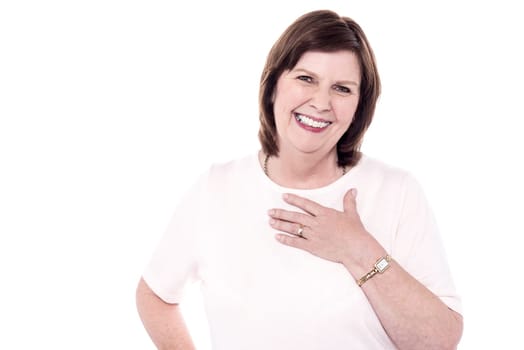 Senior woman welcoming with a warm smile