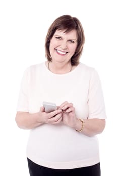 Happy Senior woman holding her cell phone