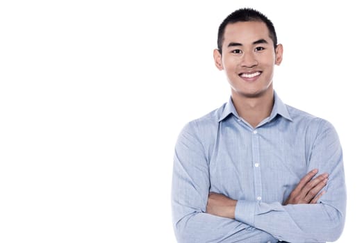 Confident young man looking at camera over white