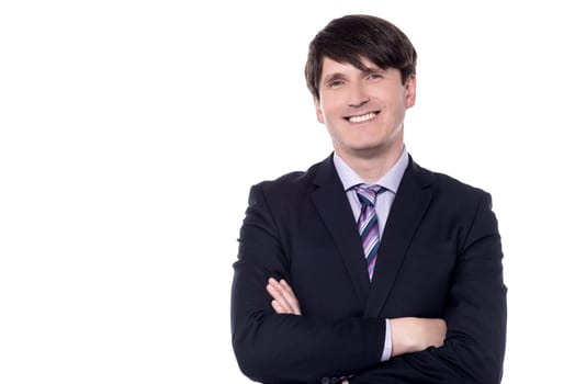 Portrait of a smiling businessman with folded arms