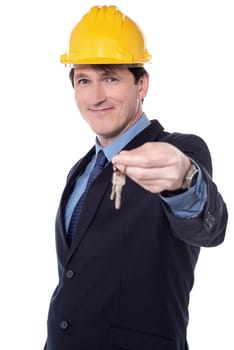 Male architect offering a new house key