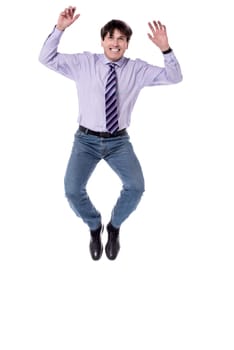 Businessman jumping in air against white background