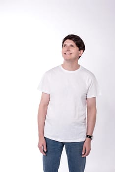 Casual man looking up against white background