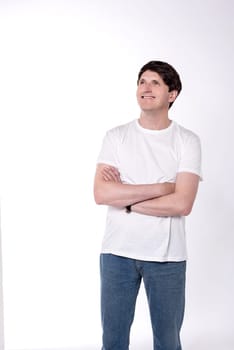 Casual man looking up with folded arms