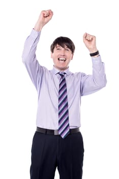 Successful male executive clenching his fists over white