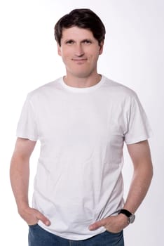 Cool handsome guy posing in style over white
