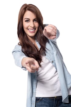 Casual woman pointing at camera