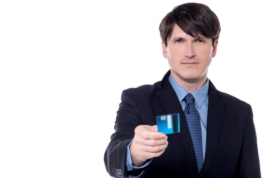 Male executive offering cash card over white