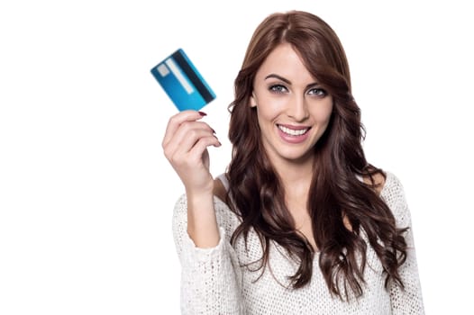 Young woman showing her credit card
