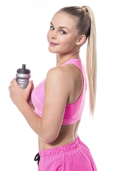 Side shot of pretty trainer holding sipper