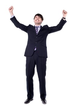 Successful businessman clenching fists