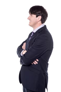Side shot of a businessman with folded arms