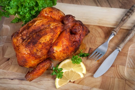 Add a whole fried chicken on a cutting board