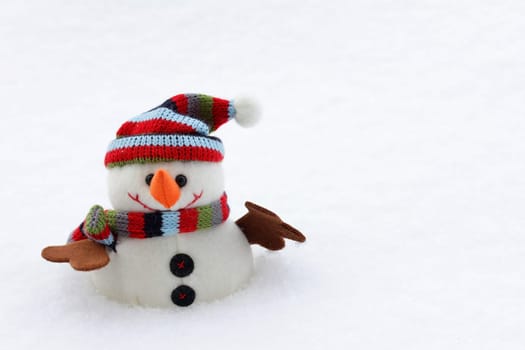 A snowman with a hat and scarf