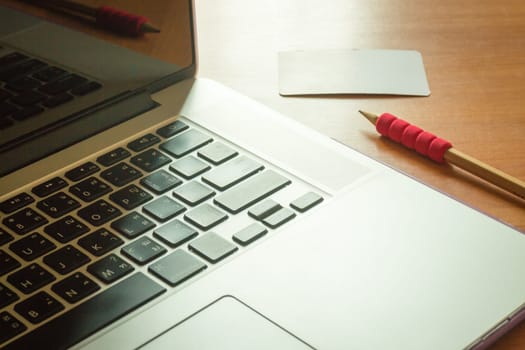 Simply freelance work table with laptop, stock photo