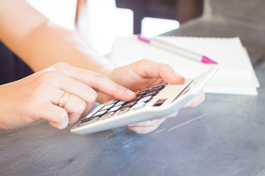 Hands holding and press calculator, stock photo