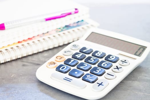 Calculator, pen and notepad for notes, stock photo