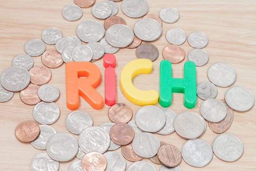 Rich alphabet with various US coins, stock photo