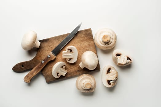 Fresh mushrooms champignons isolated on a white background.