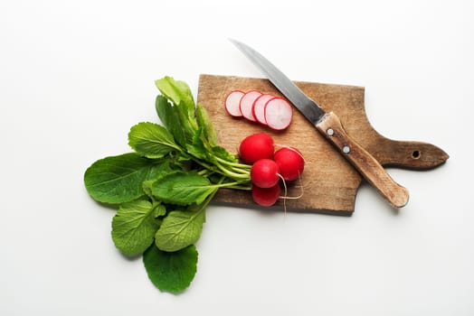 Fresh red radish isolated on a white background close up.