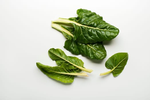 Fresh swiss chard leaves isolated on a white background.
