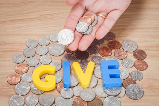 Give alphabet with various US coins, stock photo