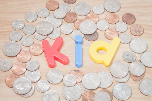 Kid alphabet with various US coins, stock photo