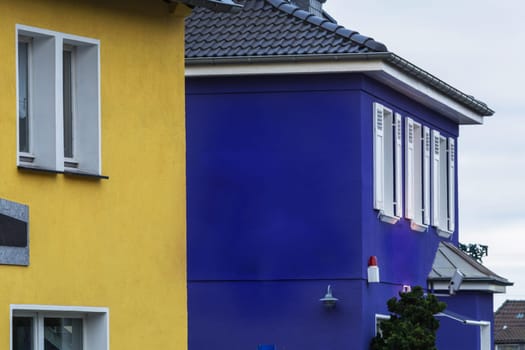Side view of two houses overlooking an alarm system.
