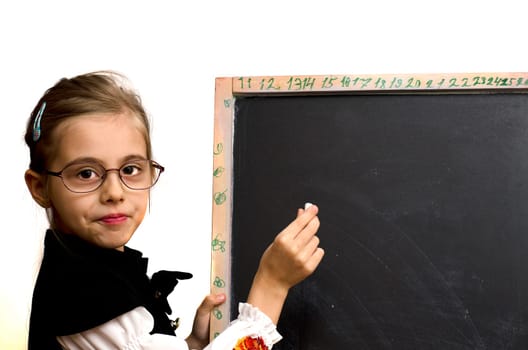 schoolgirl wrote on the blackboard isolated on a white background