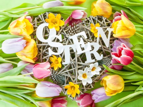 Heart of branches with feathers and crocus at Easter