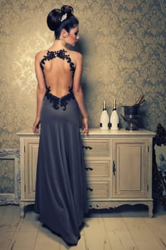 elegant woman in anthracite evening dress